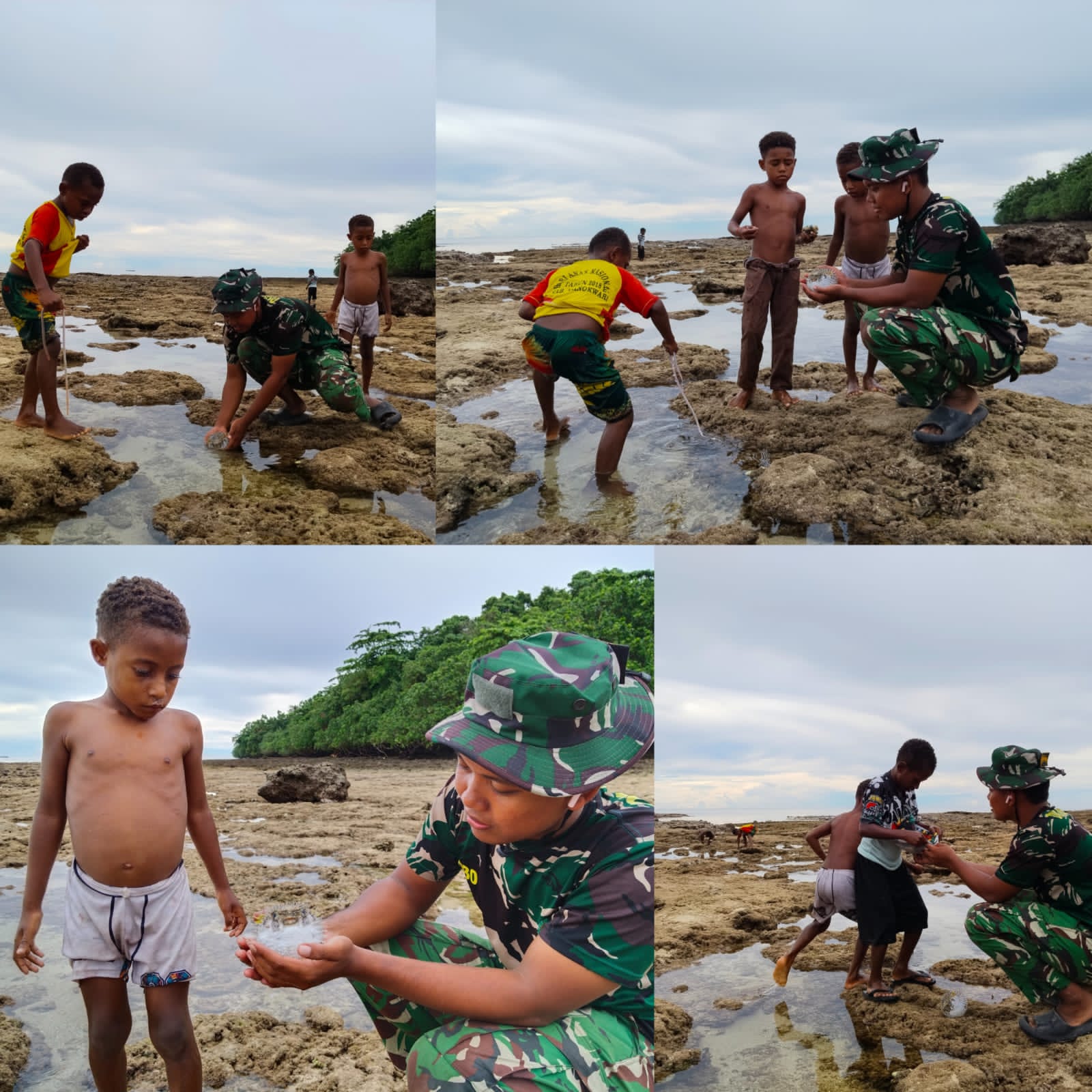 Personel Satgas TMMD Bermain dan Mencari Ikan Bersama Anak-anak Saat Air Laut Surut